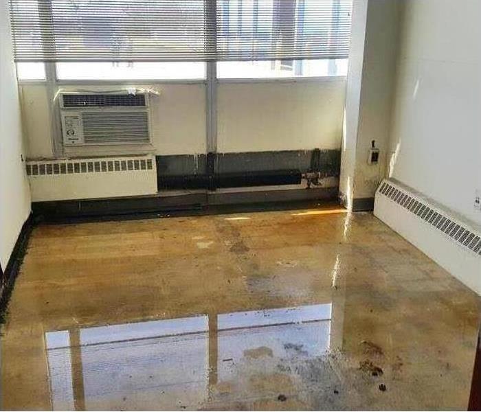 Flooded commercial floor with a few inches of water
