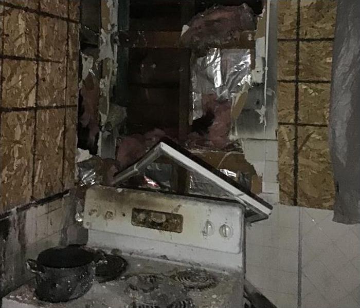 fire, smoke and soot damage to small kitchen