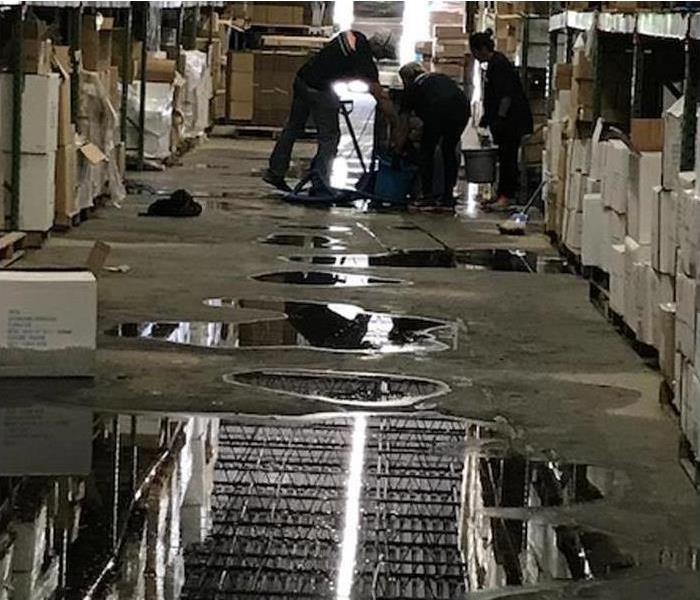 flooded warehouse floor and contents